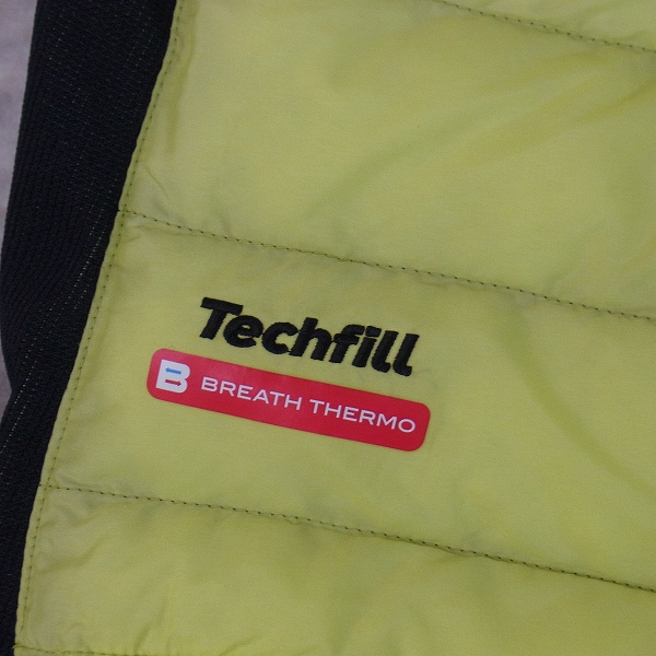 実際に弊社で買取させて頂いたMIZUNO/ミズノ ゴルフウェア 中綿ブルゾン カーキ×イエロー/XLの画像 4枚目