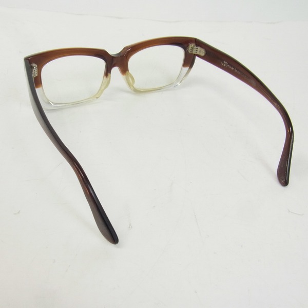 実際に弊社で買取させて頂いたOLIVER GOLDSMITH/オリバーゴールドスミス KOLUS 度入り眼鏡/メガネフレーム クリア/茶 の画像 1枚目