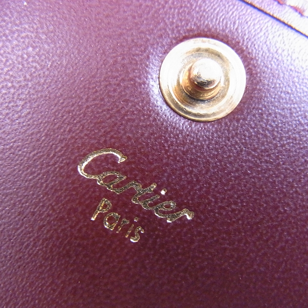 実際に弊社で買取させて頂いたCartier/カルティエ レザー コインケース 小銭入れ マストライン ロゴ ボルドー の画像 4枚目